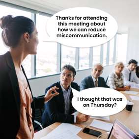 Cartoon: colleagues discover their meeting about reducing miscommunication was scheduled for different days.