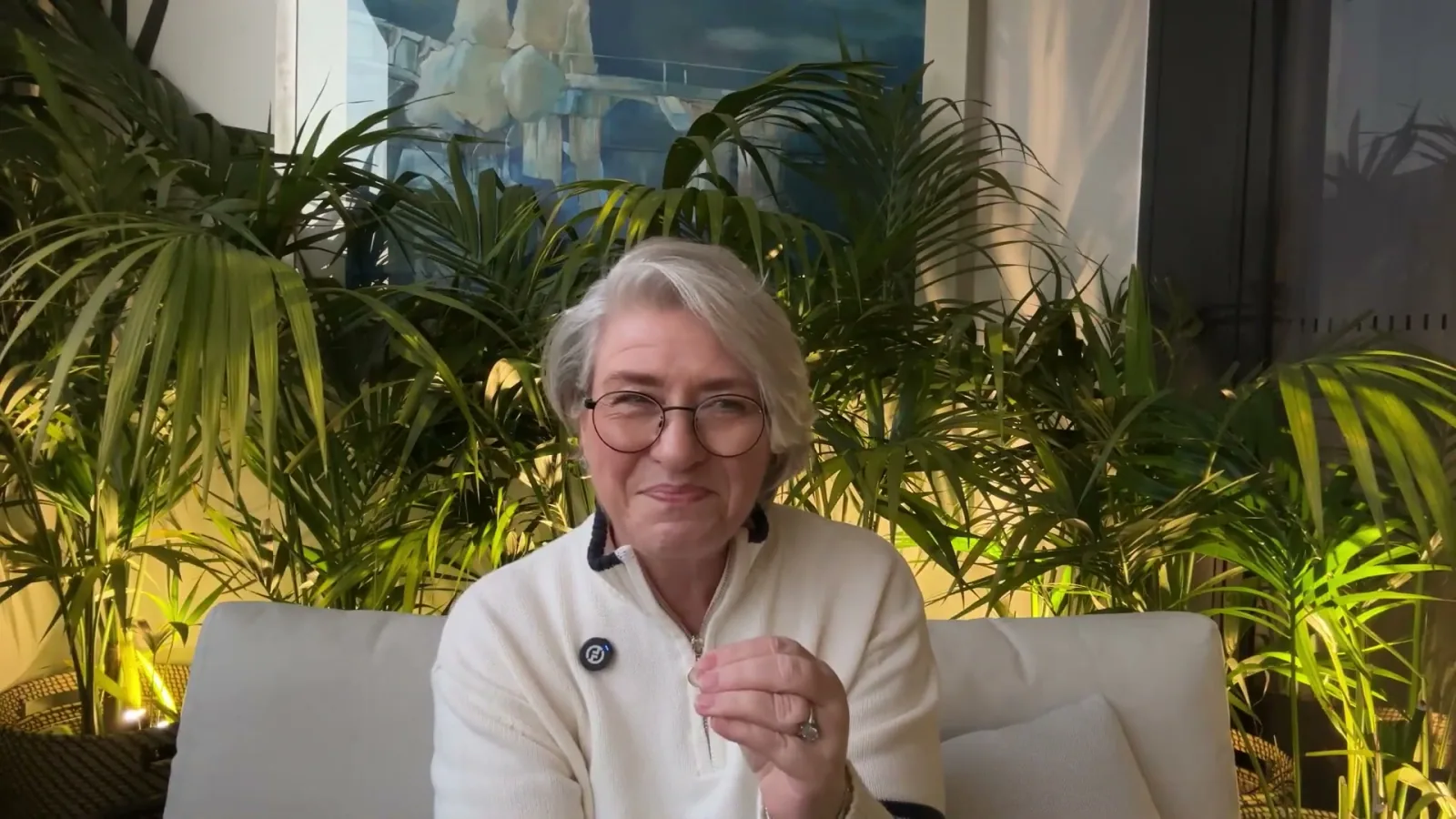 Christine Beard speaking with indoor plants behind her